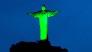 View of the statue of Christ the Redeemer illuminated in green to celebrate the upcoming Irish festivity of Saint Patrick's Day, atop Corcovado hill in Rio de Janeiro, Brazil, on March 15, 2015.   AFP PHOTO / YASUYOSHI CHIBA