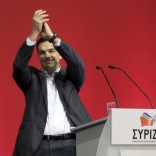 Tsipras hands in air