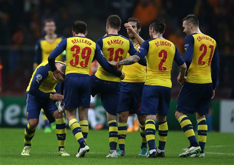 Arsenal's Aaron Ramsey celebrates with teammates