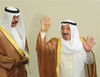 The Amir of Kuwait Sheikh Sabah Al-Ahmad Al-Jaber Al-Sabah, right, arrives at Kuwait's Parliament accompanied by the country's Crown Prince Sheikh Nawaf Al Ahmad Al Sabah Tuesday, Oct.2 5, 2011.