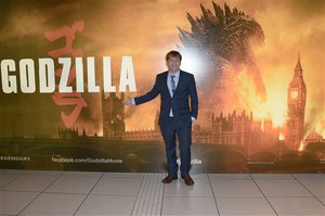 Director Gareth Edwards poses for photographers during the UK premiere of Godzilla in London on Sunday, May 11, 2014.