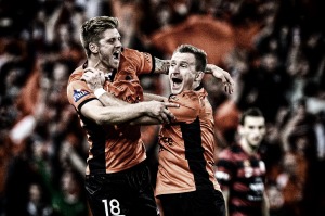 That special feeling: Luke Brattan and Besart Berisha of the Brisbane Roar celebrate victory as the full-time siren sounds in the 2014 A-League grand final against the Western Sydney Wanderers.