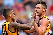 Jack Gunston of the Hawks is congratulated by Bradley Hill after kicking a goal.