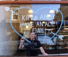 Connor Wilson decorates the window of Bennetts Deli. Picture: Lisa Ferguson