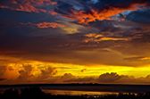 'This month's winner of the Autumn Skies Photo Competition is Heather Blechynden, who sent us this beautiful shot of a vast golden sky with it's layers of cloud formations.

Congratulations Heather, and thank you to everyone who entered.'