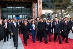 President Barack Obama and Asia-Pacific Economic Cooperation (APEC) leaders exit the International Convention Center to participate in a tree planting ceremony in Beijing, China, Nov. 11, 2014. Among those walking with the President are: President Michelle Bachelet, Chile; President Xi Jinping, China; Sultan Haji Hassanal Bolkiah, Brunei Darussalam; President Vladimir Putin, Russia and President Joko Widodo, Indonesia.