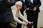 Defendant Oskar Groening arrives in the court room in Lueneburg, northern Germany, Tuesday, April 21, 2015.