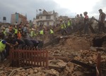 Rescuers clear the debris at Durbar Sqaure after an earthquake in Kathmandu, Nepal, Saturday, April 25, 2015.