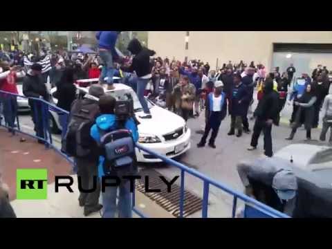 Baltimore: Protesters smash cars, clash with police