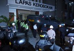 An Indonesian police vehicle carries Australian death row prisoners, Andrew Chan and Myuran Sukumaran during their transfer at a prison in Bali, Indonesia, Wednesday, March 4, 2015.