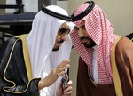 FILE- In this Monday, May 14, 2012 file photo, Crown Prince Salman bin Abdul-Aziz Al Saud, left, speaks with his son Prince Mohammed as they wait for Gulf Arab leaders ahead of the opening of Gulf Cooperation Council, also known as GCC summit, in Riyadh, Saudi Arabia. Its new king, Salman, on Friday, Jan. 23, 2015, appointed his son, Prince Mohammed, as Defense Minister. The prince, in his 30s, was head of his father's royal court when Salman was crown prince and is among his most-favored sons.