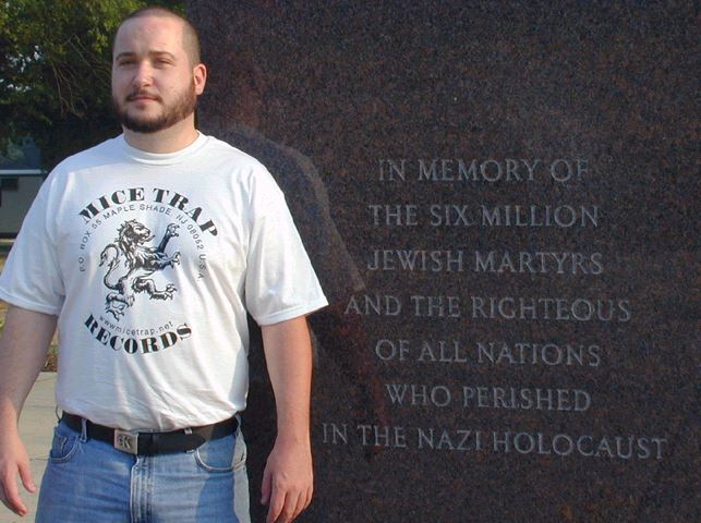 During his deposition for the lawsuit, Wiegand was asked why he posed for this picture. His response was”no reason.” If you’re going to be the kind of shit stain that profits off mass murder, at least don’t be a coward about it too.