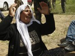 File - A Yazidi released by Islamic State group militants cries for her other family members still captured by the IS group upon her arrival in Kirkuk, 180 miles (290 kilometers) north of Baghdad, Iraq, Wednesday, April 8, 2015.