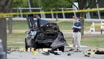 An FBI crime scene investigator documents evidence outside the Curtis Culwell Center, Monday, May 4, 2015, in Garland, Texas. Two men opened fire with assault weapons on police Sunday night who were guarding a contest for Muslim Prophet Muhammed cartoons.