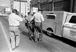 A police officer holds the Rev. Martin Luther King Jr. by his belt as he leads him to the paddy wagon, following arrest at an anti-segregation protest in downtown Birmingham, Ala., on April 13, 1963.