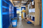 File - Scene from an Ebola treatment facility run by Médecins Sans Frontières (MSF) in Guéckédou, Guinea, on the day of a visit from Anthony Banbury, Special Representative of the Secretary-General and Head of the UN Mission for Ebola Emergency Response (UNMEER)