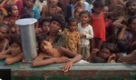 Myanmar migrants on a boat stranded for a week in the Andaman Sea with no food or water. 14 May 2015.