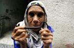 File - A Palestinian refugee, Subhia Abdul Rahim Abu Ghali, 79 years old, from the Rafah refugee camp, holds up a key allegedly from her house in Yebna located in southern Israel. On May 15th Palestinians mark the "Nakba", or "Catastrophe" in reference to the birth of the state of Israel 66-years-ago in British-mandate Palestine.