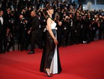 File - Sophie Marceau, wearing high heels, poses for photographers upon arrival for the screening of the film The Sea of Trees at the 68th international film festival, Cannes, southern France, Saturday, May 16, 2015.