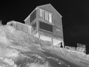 Image: Sand erodes beneath a house