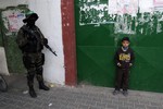 A Palestinian member of Hamas's armed wing on patrol during an anti-Israel rally in Rafah in the southern Gaza Strip, on November 13, 2014.