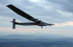 In this Monday, June 2, 2014 file photo, German test pilot Markus Scherdel steers the solar-powered Solar Impulse 2 aircraft for its maiden flight at its base in Payerne, Switzerland.