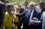 FIFA President Sepp Blatter meets Palestinian kids during the inauguration of a football stadium in the village Dura Al-Qari' near the West Bank city of Ramallah, Wednesday, May 20, 2015.