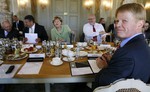 German Finance Minister Wolfgang Schaeuble, left to right, Economy Minister Sigmar Gabriel, Chancellor Angela Merkel, Head of the Federal Chancellery Peter Altmeier, head of the Federation of German Unions,DGB, Reiner Hoffmann and Labor Minister Andrea Nahles attend a meeting with members of the government, representatives of industry and labor union organizations at the guesthouse of the government in Meseberg some 60 km (37 miles) north of Berlin, Germany, Thursday, June 4, 2015.