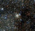 File - This NASA/ESA Hubble Space Telescope image presents the Arches Cluster, the densest known star cluster in the Milky Way.