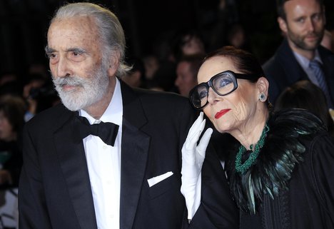 File - Christopher Lee, left, and Birgit Kroencke arrive at the world premiere of "Skyfall" at the Royal Albert Hall on Tuesday, Oct. 23, 2012 in London.