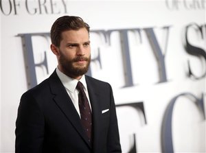 Jamie Dornan poses for photographers upon arrival at the UK premiere of the film 'Fifty Shades of Grey' in London, Thursday, Feb. 12, 2015.