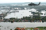 File - An SH-60F Sea Hawk helicopter assigned to Helicopter Anti-Submarine Squadron (HS) 14, flies around the Bangkok area with members of the humanitarian assessment survey team and the Royal Thai Armed Forces to assess the damage caused by flooding, 22 October, 2011.