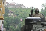 File - A U.S. Army infantryman, assigned to 2nd Squadron, 2nd Cavalry Regiment, rides in the gunner position of a Stryker armored vehicle during a parade welcoming the Soldiers to the city of Brasov, Romania, May 14, 2015 during the unit’s Cavalry March, part of ‪‎Operation Atlantic Resolve.