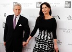 File - Actors Michael Douglas and wife Catherine Zeta-Jones attend the 41st Annual Chaplin Award Gala honoring Rob Reiner at Avery Fisher Hall on Monday, April 28, 2014 in New York.