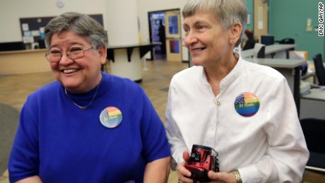 Carmelita Cabello, left, and her partner of 31 years, Jaque Roberts, arrive at the Travis County building for a marriage license after hearing the Supreme Court ruling that grants same-sex couples the right to marry nationwide, Friday, June 26, 2015, in Austin, Texas.