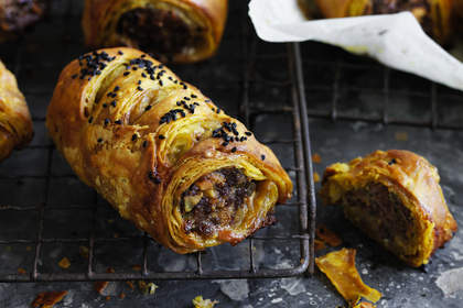 Lamb pistachio sausage rolls with turmeric pastry.