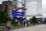 File - The European Central Bank. Notice a sculpture of the euro sign.