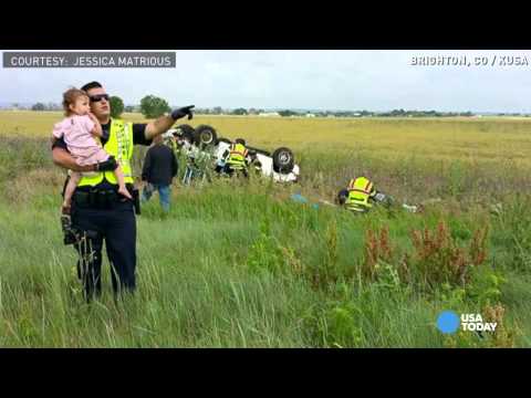 Cop comforts 2-yr-old after dad's deadly accident