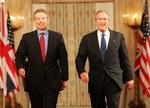 File - President George W. Bush speaks to the audience Thursday night, May 25, 2006, in the East Room during a joint press availability with Prime Minister Tony Blair, of Great Britain, about Iraq's new government.