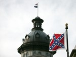 A Confederate battle flag flies in front of the South Carolina statehouse Wednesday, July 8, 2015, in Columbia, S.C.