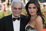 File - Omar Sharif with Cyrine Abdelnour at the Venice Film Festival in 2009.