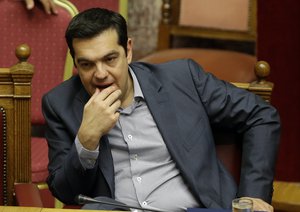 Greece's Prime Minister Alexis Tsipras reacts during a parliament meeting in Athens, Saturday, July 11, 2015.