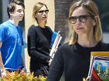 UK CLIENTS MUST CREDIT: AKM-GSI ONLY\nEXCLUSIVE: Calista Flockhart helps her son Liam with a school project at the library in Santa Monica, CA on July 11, 2015.\n\nPictured: Calista Flockhart and Liam Flockhart\nRef: SPL1077270  110715   EXCLUSIVE\nPicture by: AKM-GSI / Splash News\n\n