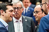 Greek Prime Minister Alexis Tsipras, left, speaks with, from left, European Commission President Jean-Claude Juncker, French President Francois Hollande and Belgian Prime Minister Charles Michel during a meeting of eurozone heads of state at the EU Council building in Brussels on Sunday, July 12, 2015. Skeptical European creditors raced Sunday to narrow differences both among themselves and with Athens, aiming to come up with a tentative agreement to stave off an immediate financial collapse in Greece that would reverberate across the continent. (AP Photo/Geert Vanden Wijngaert)