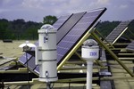 Second and third generations of cloud cameras installed on roof of IBM labs used in IBM's solar forecasting technology. The camera designs have come a long way since IBM built the first one. The camera is almost 10x smaller now, and to avoid saturation it uses electronics rather than a mechanical shutter. Because of their compact size, the new cameras can be readily deployed at a solar power plant, where can measure the height of the clouds using triangulation techniques. This in turn helps to improve the forecasts further.