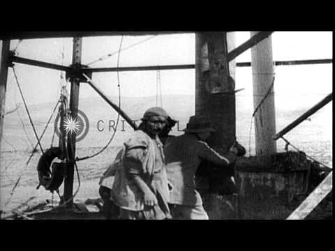 British syndicate strikes oil at 1200 feet in Masjid-i-Suleiman, Iran. George Rey...HD Stock Footage