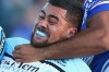 In the spotlight: Andrew Fifita is wrestled to the ground.