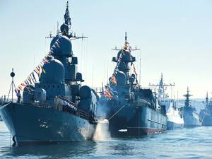 24 July 2015: Russian navy battle ships station in the bay during a rehearsal of the Russian Navy Day parade in Sevastopol, Crimea. The Russian Navy Day is celebrated the last Sunday of July