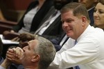 Boston Mayor Marty Walsh, right, greets New York Mayor Bill de Blasio, during a conference on Modern Slavery and Climate Change in the Synod Hall at the Vatican, Tuesday, July 21, 2015.