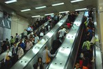 Escalators connecting the Wenhu Line platform and the Nangang Line concourse. The Taipei Metro Zhongxiao Fuxing Station is located in the Da'an District in Taipei, Taiwan.